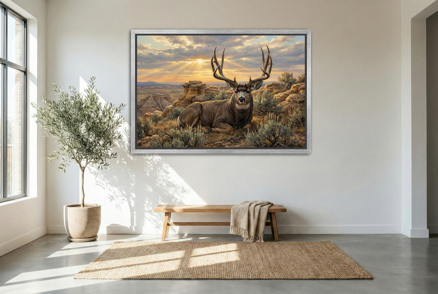 silver floating framed canvas big game artwork of a badlands mule deer bedded on a rimrock ledge