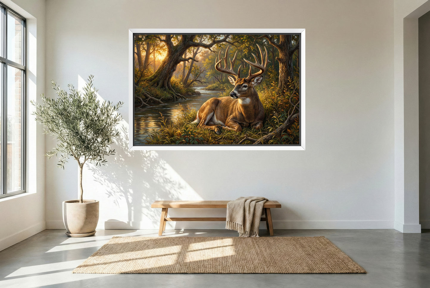 white floating framed canvas art of a bedded whitetail buck near the creekside timber