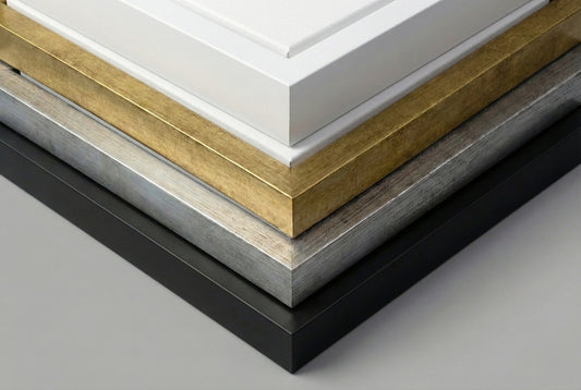 Close up comparison of floating frame color options showing black white gold and silver finishes for canvas art
