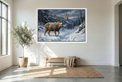 white floating framed canvas art of a mule deer buck migrating through heavy snow out of high country mule deer buck