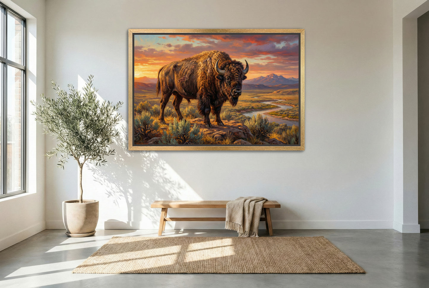 gold floating framed canvas trophy room art of a Bison standing on a rocky outcrop with a scenic landscape and sunset in the background