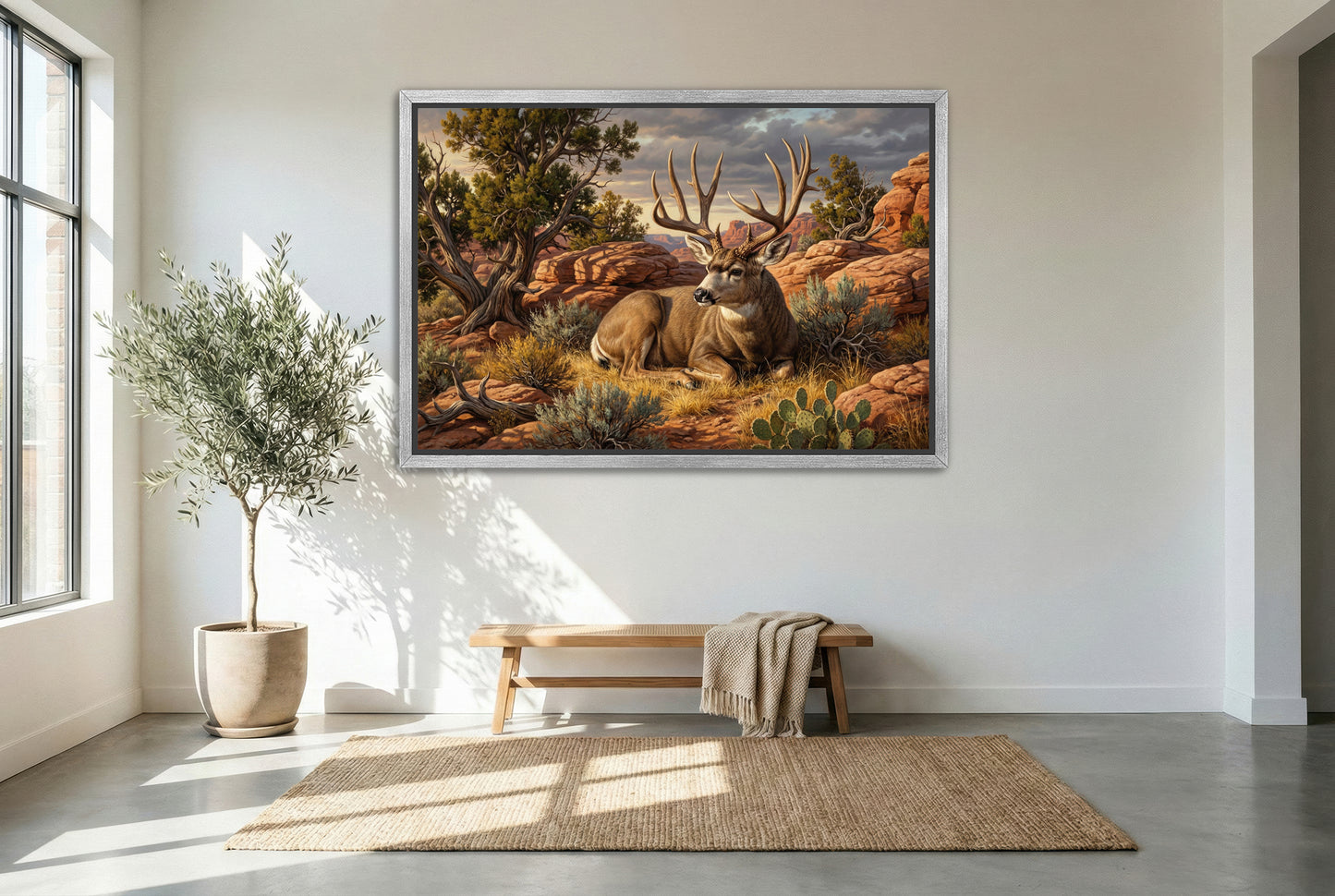 silver floating framed canvas big game artwork of a mule deer buck bedded desert red rock country