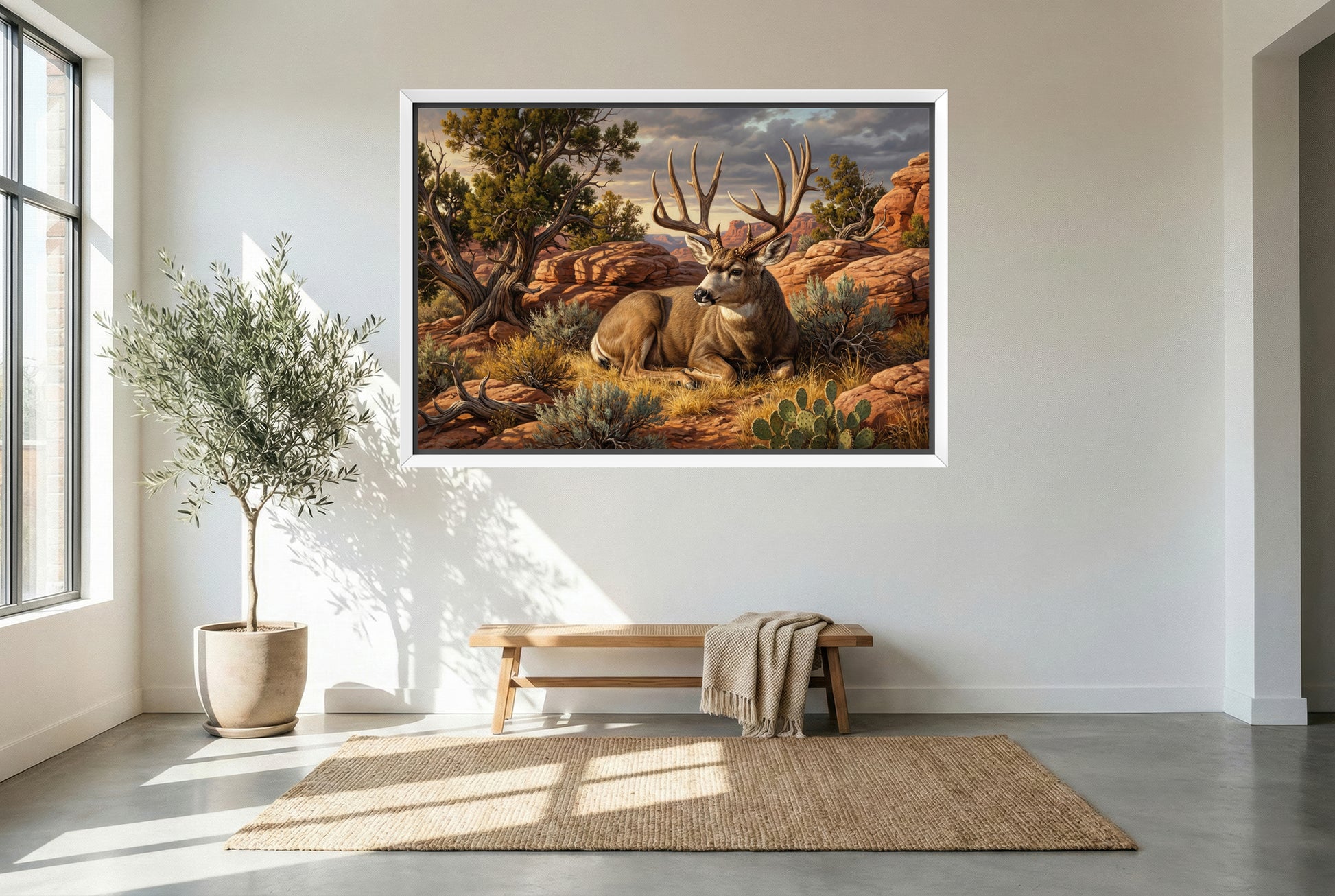 white floating framed canvas art of a mule deer buck bedded desert red rock country