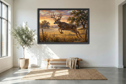 black floating framed canvas print featuring a whitetail buck fence jumper at sunrise